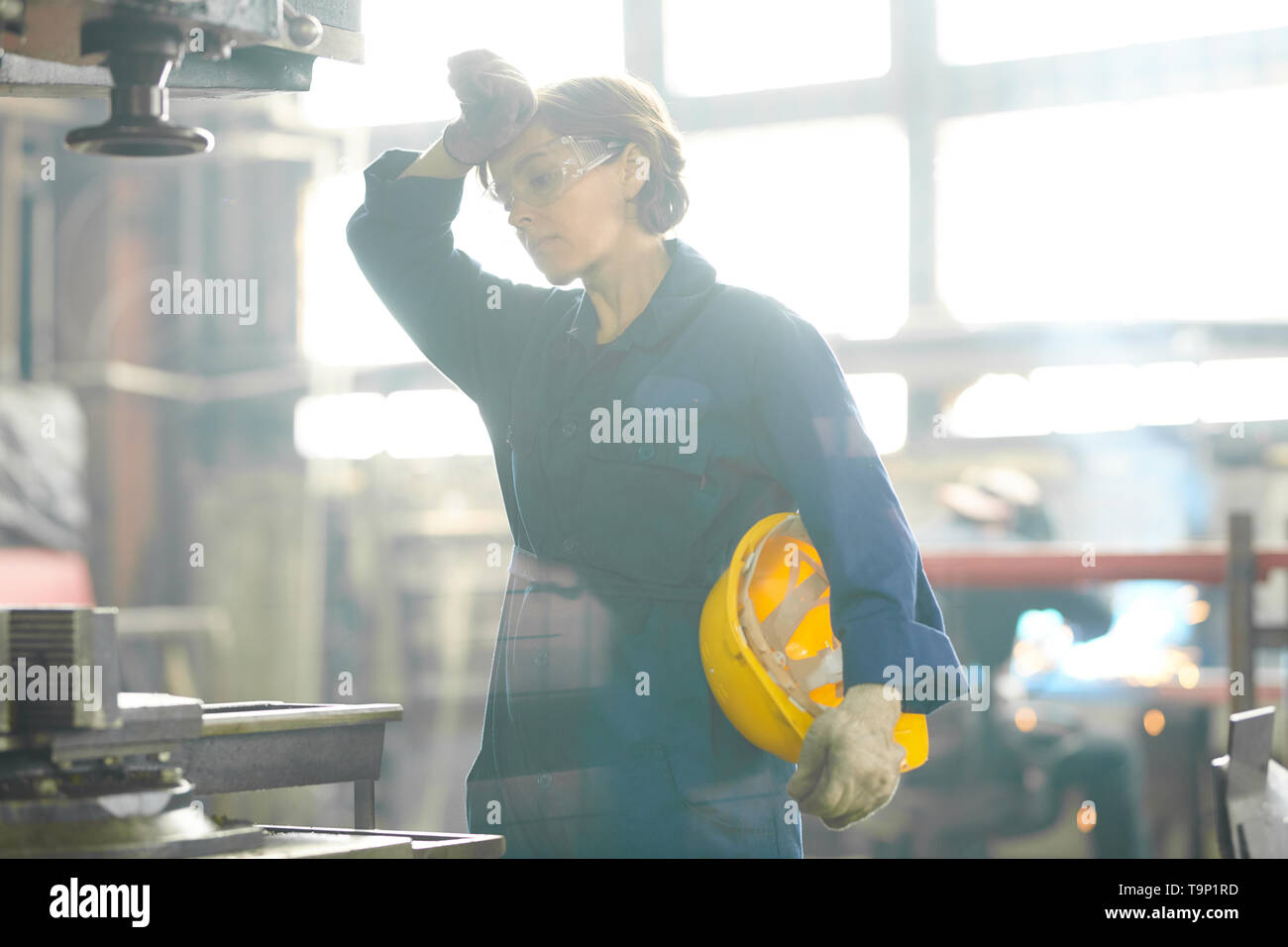 Tired Female Worker Stock Photo