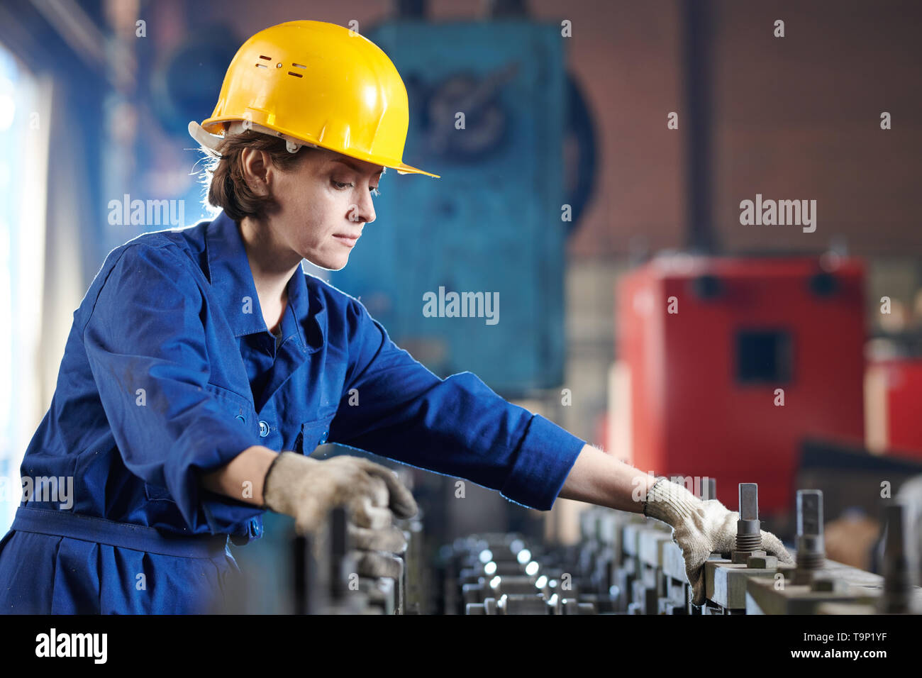 Female Worker Side View Stock Photo
