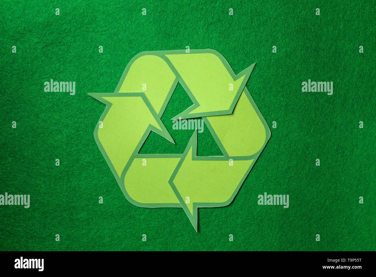 Recycling symbol on green background Stock Photo Alamy