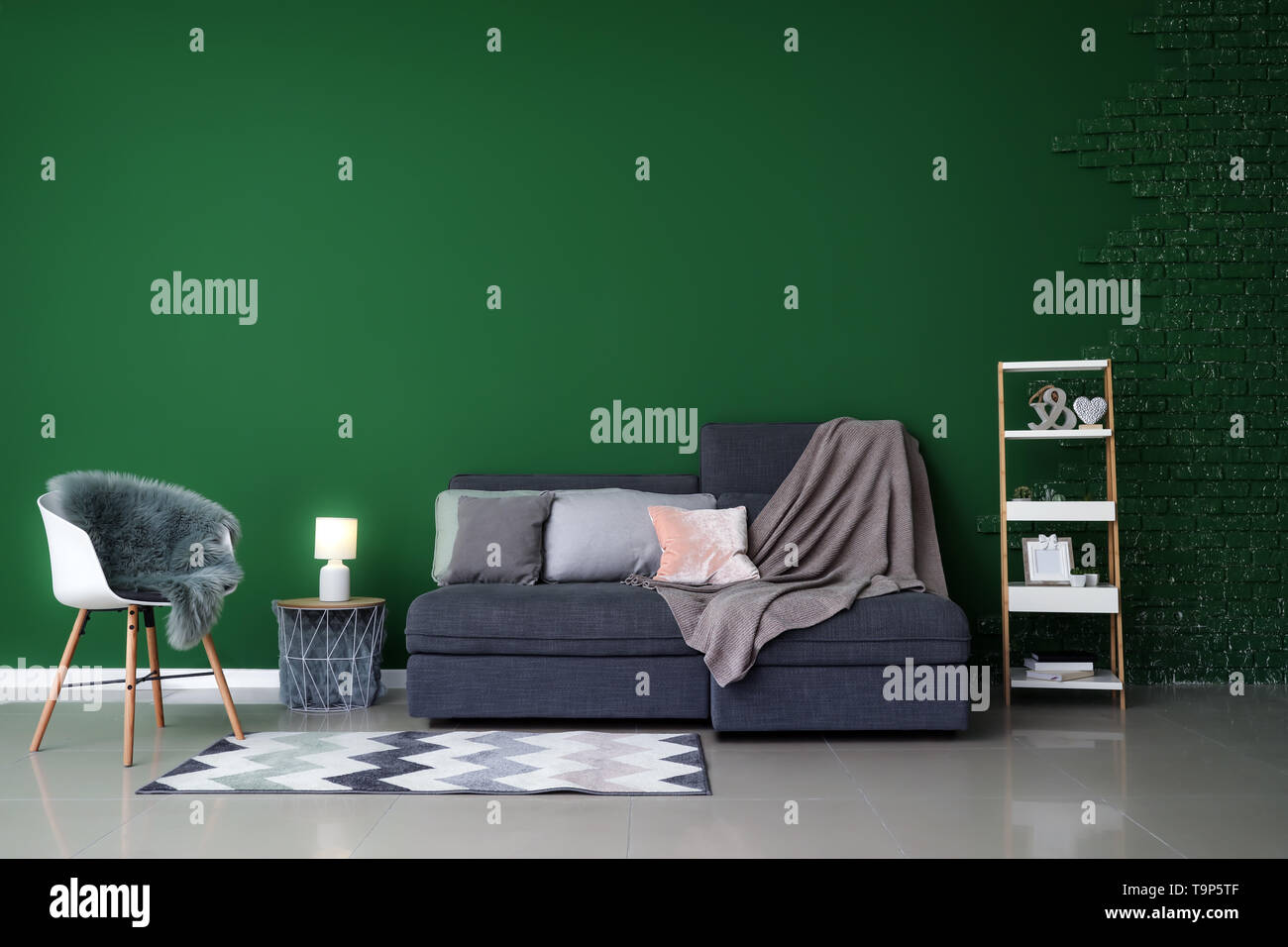 Stylish Interior Of Room With Comfortable Big Sofa Stock Photo
