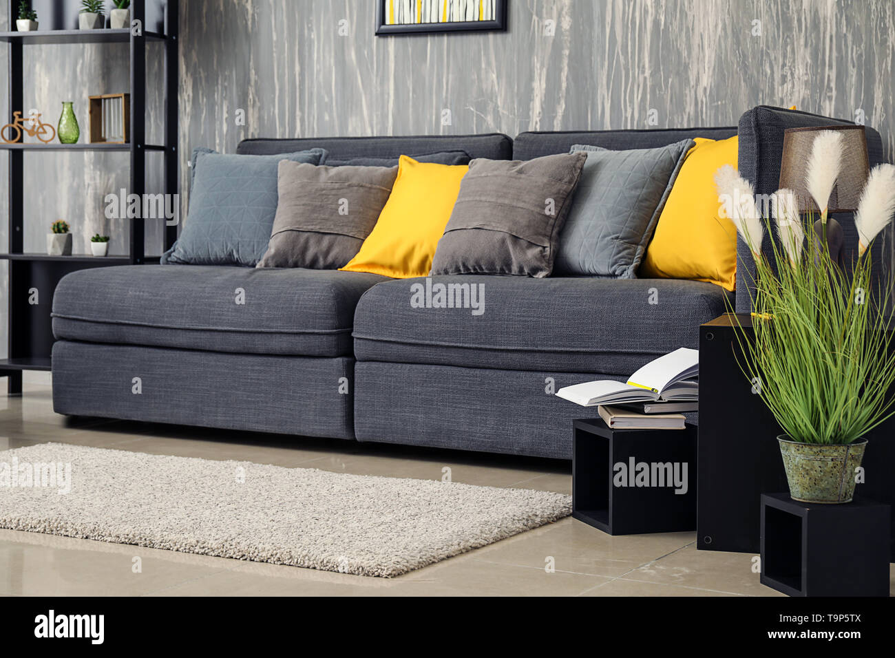 Stylish Interior Of Room With Comfortable Big Sofa Stock Photo