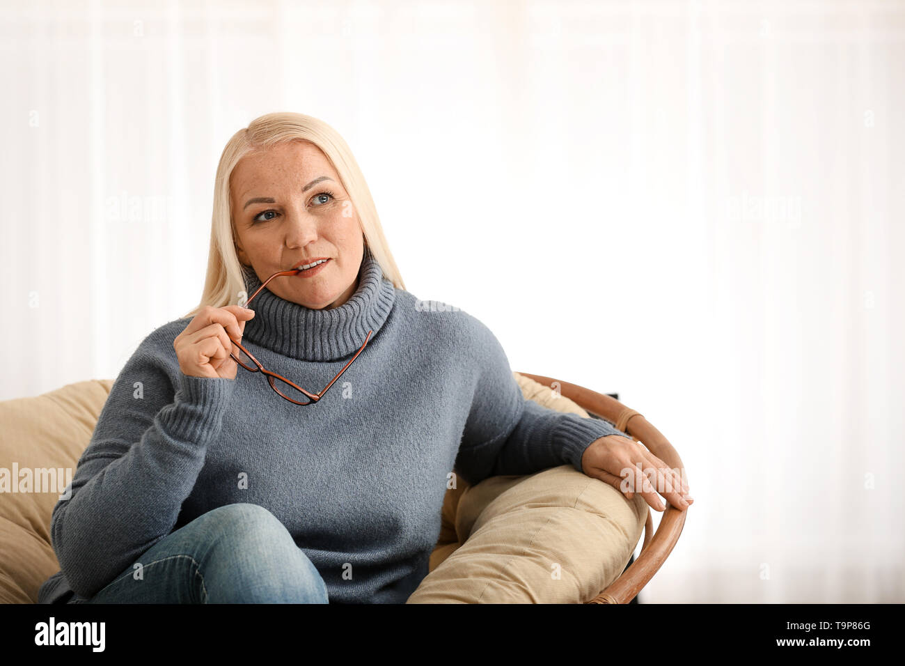 Portrait of beautiful mature woman at home Stock Photo - Alamy