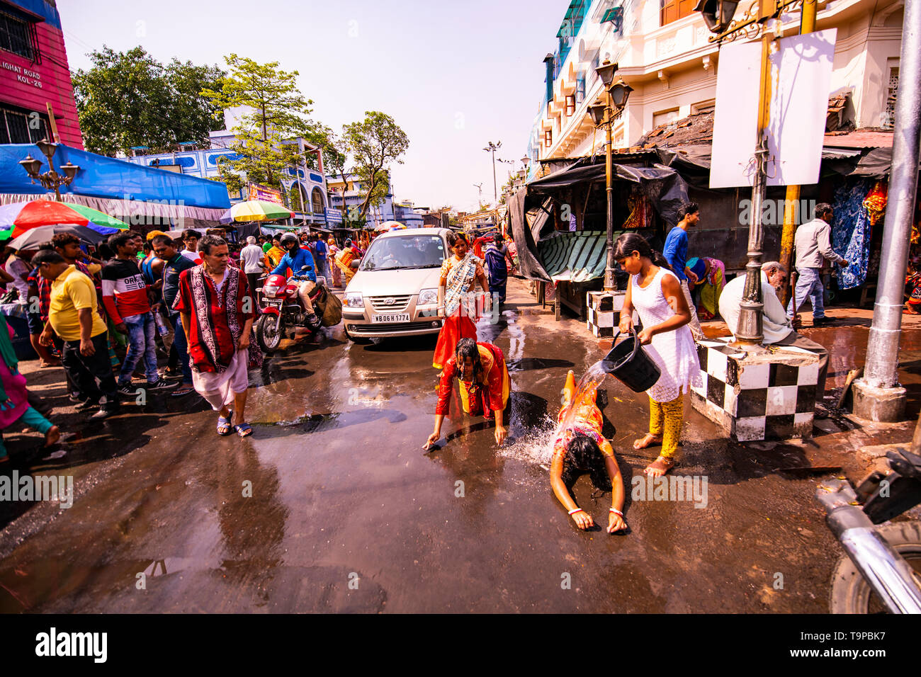 Piety,performance,doing,Dandi ,young,female worshippers,on ,Kalighat ,Temple road,Kolkata,India. Stock Photo