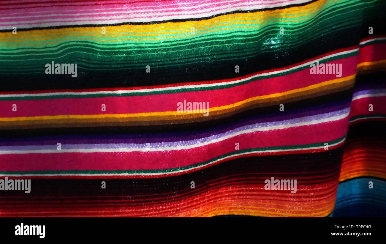 Colorful Mexican striped serape blanket or textile pattern background. Stock Photo