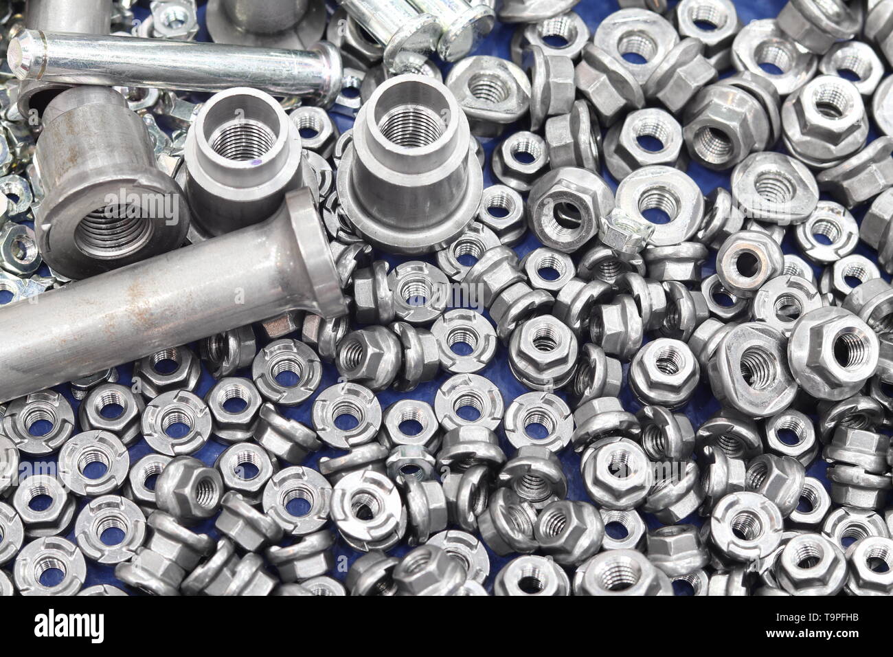 small bolts and nuts by manufacturing process ; tapping Stock Photo Alamy