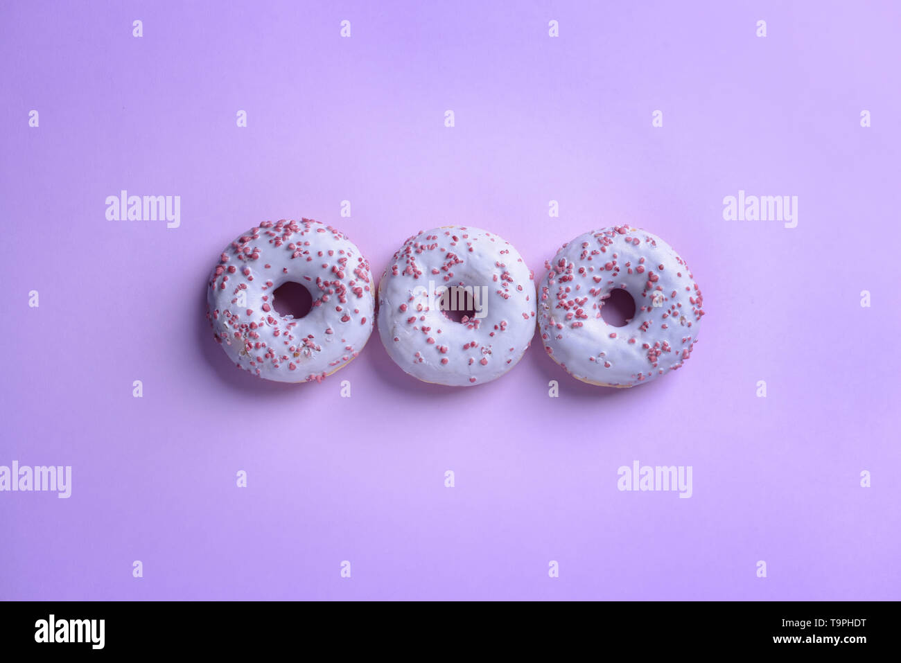 Tasty doughnuts on color background Stock Photo