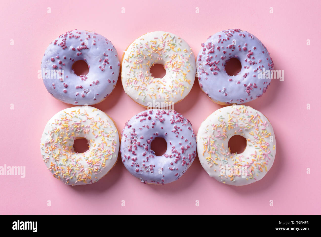 Tasty doughnuts on color background Stock Photo