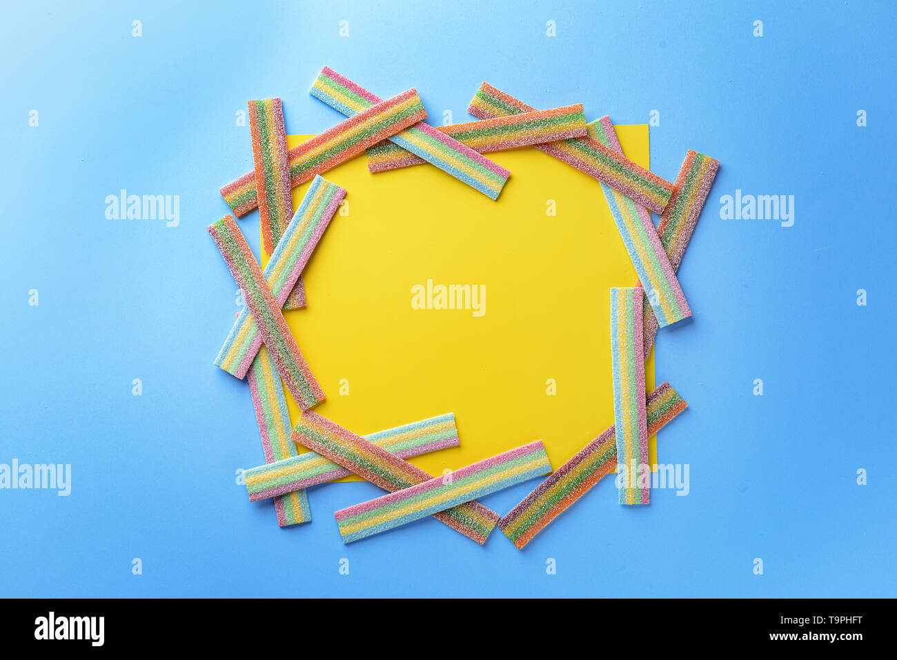 Frame made of tasty candies on color background Stock Photo - Alamy