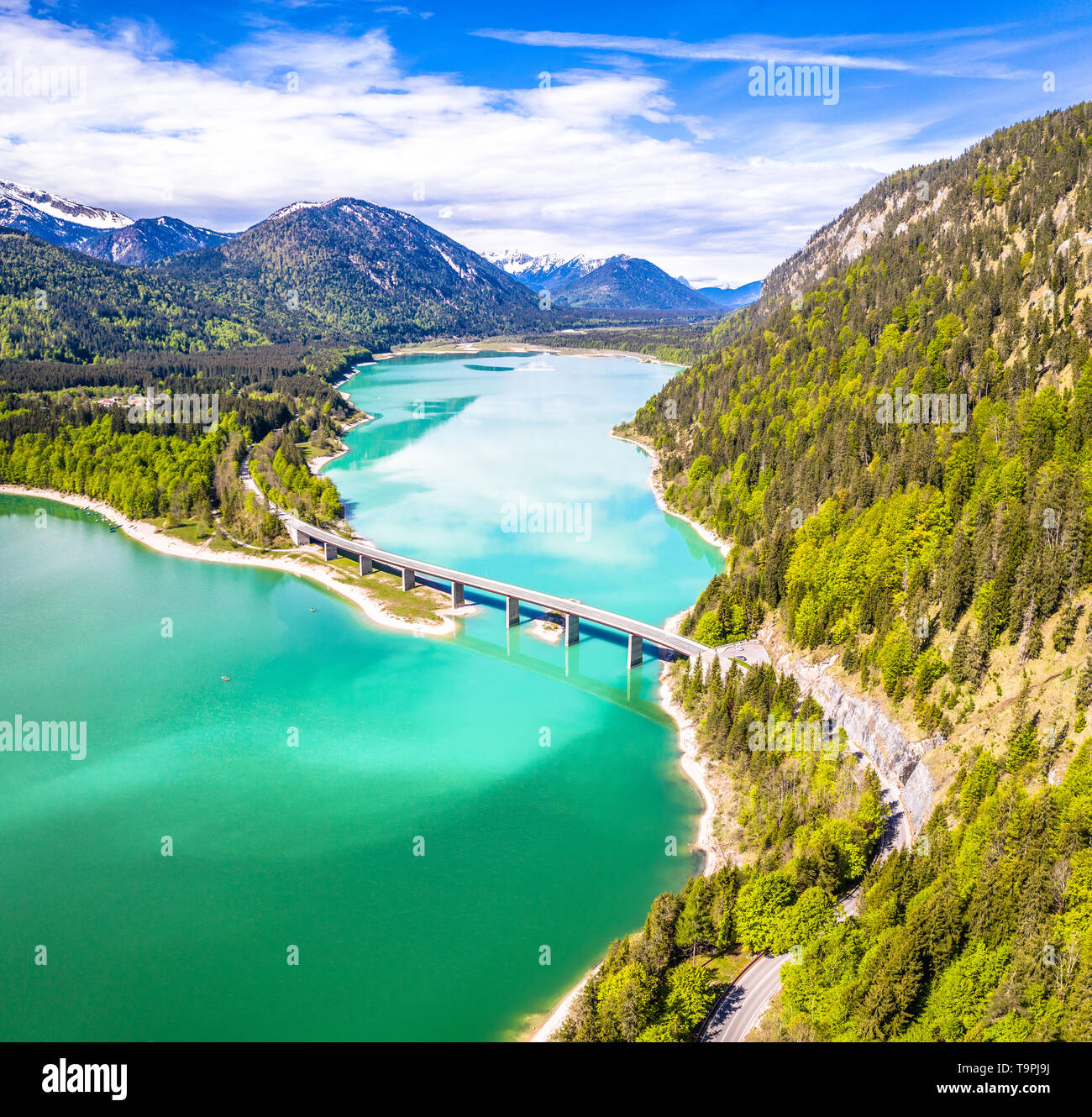 Amazing bridge over accumulation lake Sylvenstein, upper Bavaria. Aerial view. May, Germany Stock Photo