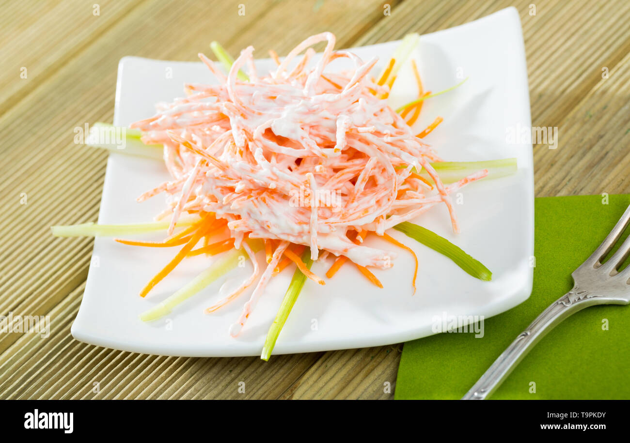 Vitamin salad with fresh julienne carrots, garlic and sour cream Stock Photo
