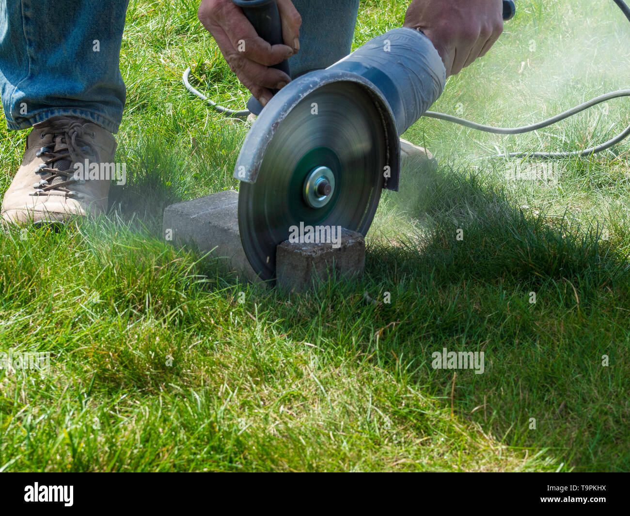 stone masonry concept, close up of cutting sandstone by industrial