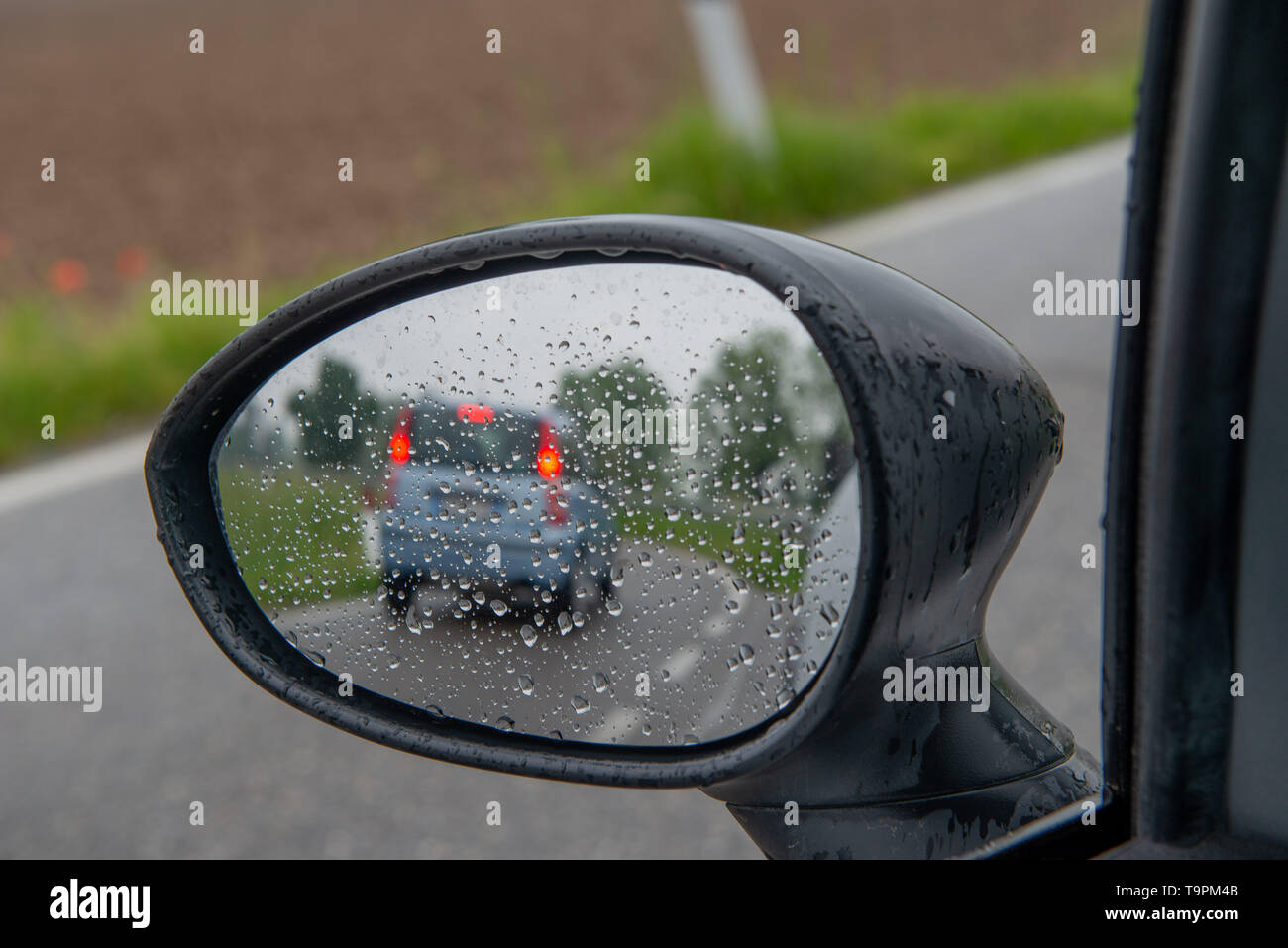 Rear mirror in rain hi-res stock photography and images - Alamy