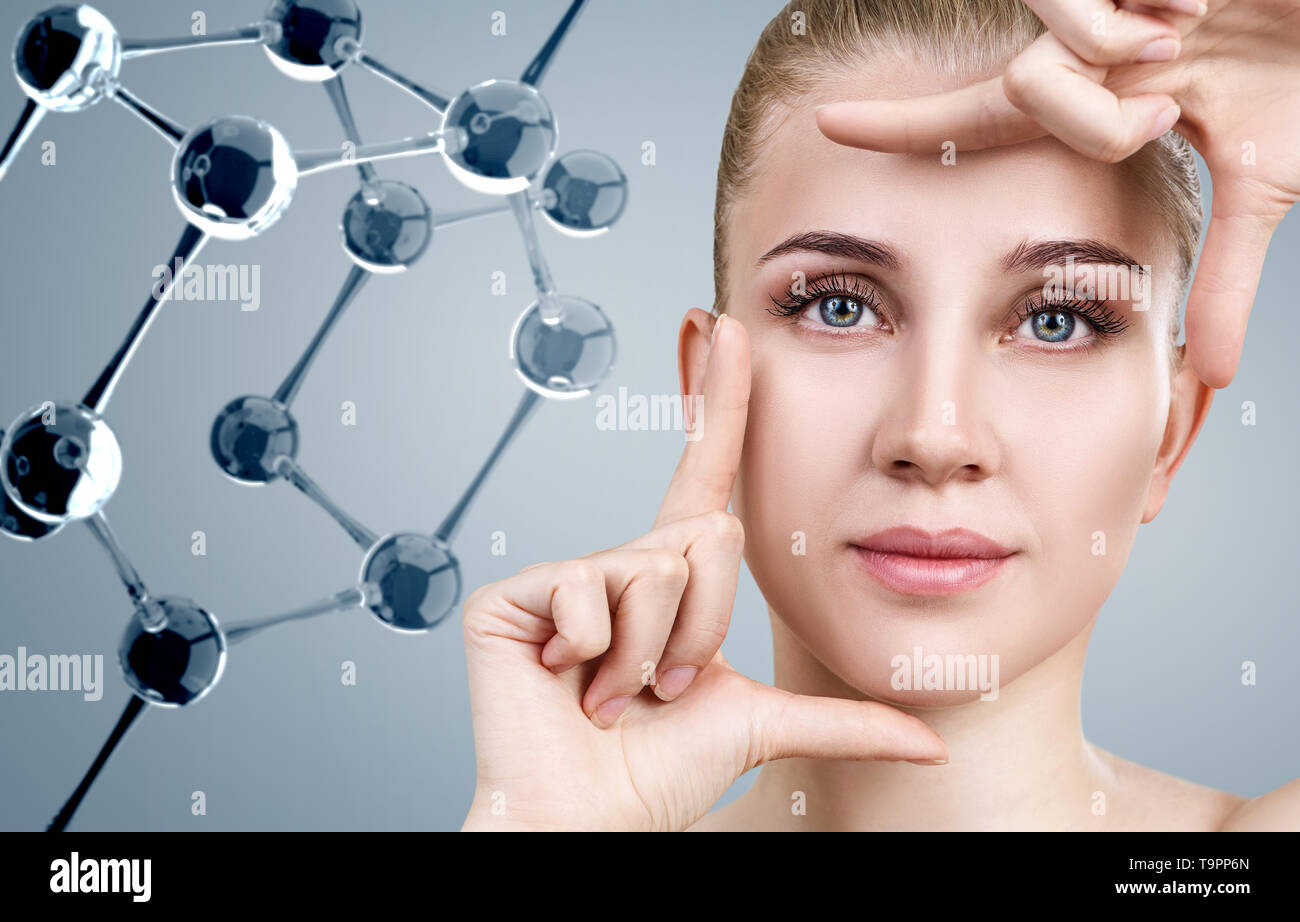 Young woman among glass molecules. Stock Photo