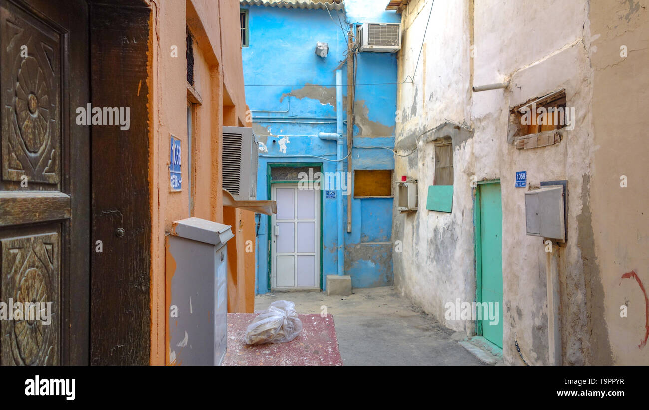 Empty alley and colorful traditional houses in Muharraq, Barhain Stock Photo