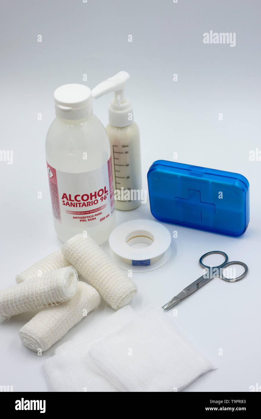 emergency kit background. products for primary cure. Alcohol sanitary, bandages, bandages and medicine gauzes. Pill box and medicine scissors. Pharma Stock Photo
