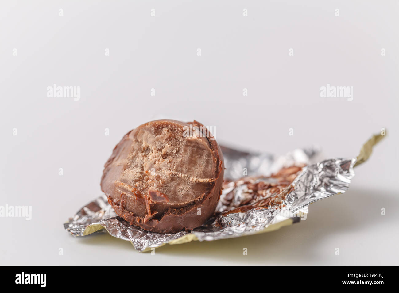 bitten chocolate candy in a candy wrapper Stock Photo: 246979422 ...