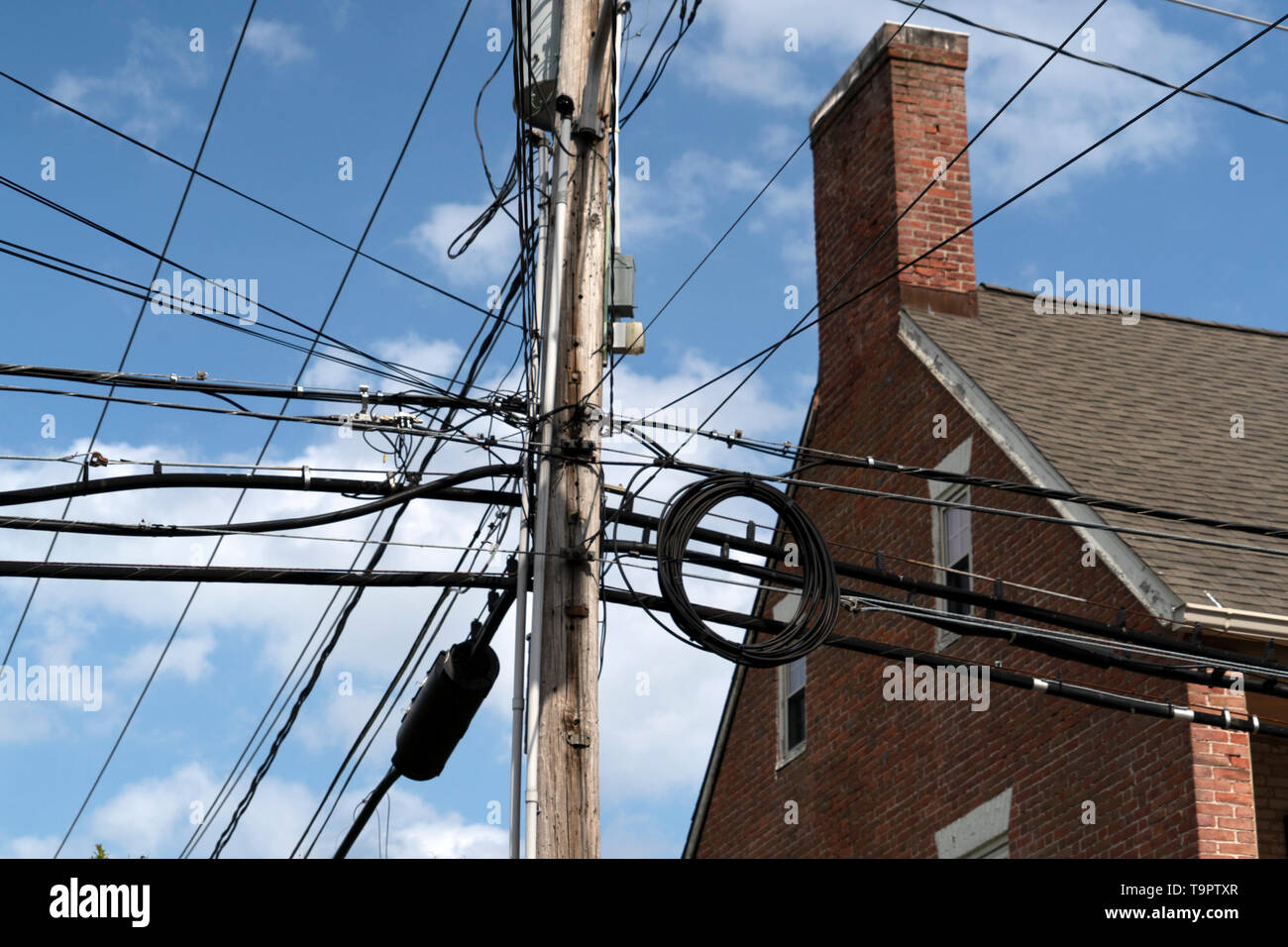 many electric cables on old maryland houses Stock Photo