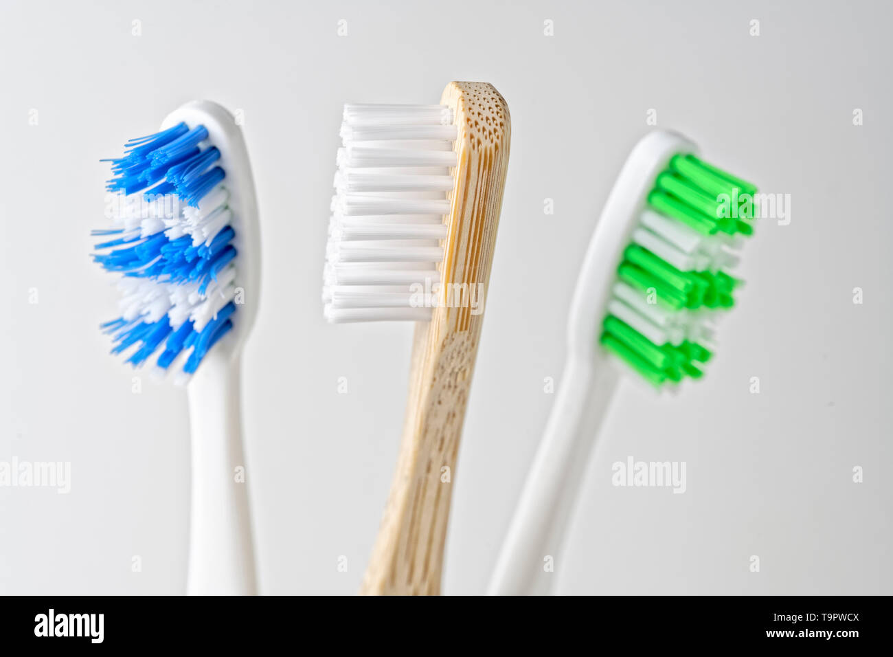 Wooden and plastic toothbrush Stock Photo