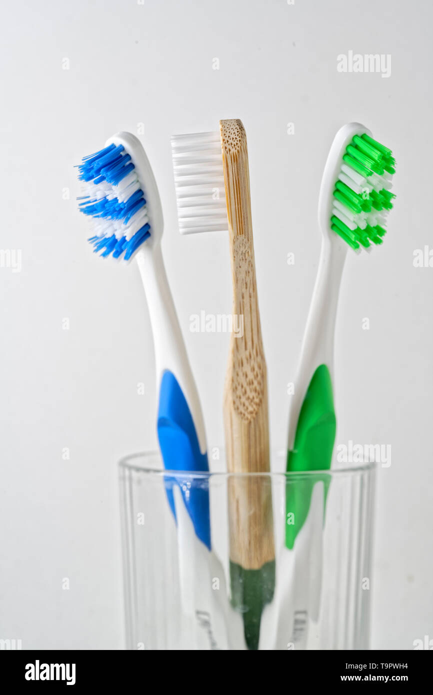 Wooden and plastic toothbrush Stock Photo