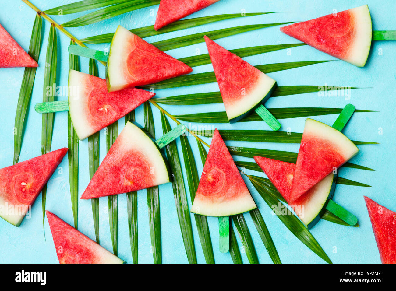 Watermelon slices on blue background. Top view. Copy space Stock Photo ...