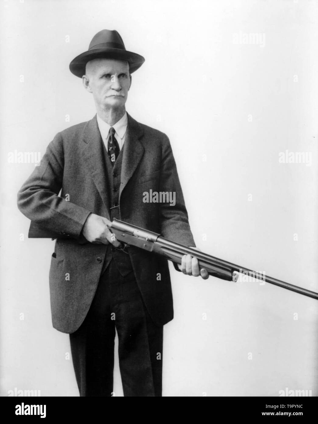 American gunmaker John Moses Browning with with his Auto 5 shotgun (circa early 1900 Stock Photo