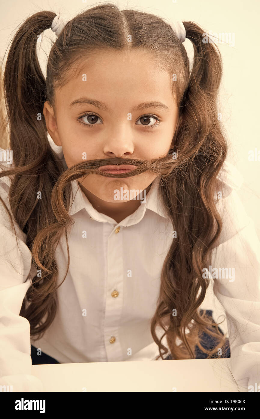 small girl with funny mustache. Small girl with long hair style Stock Photo  - Alamy