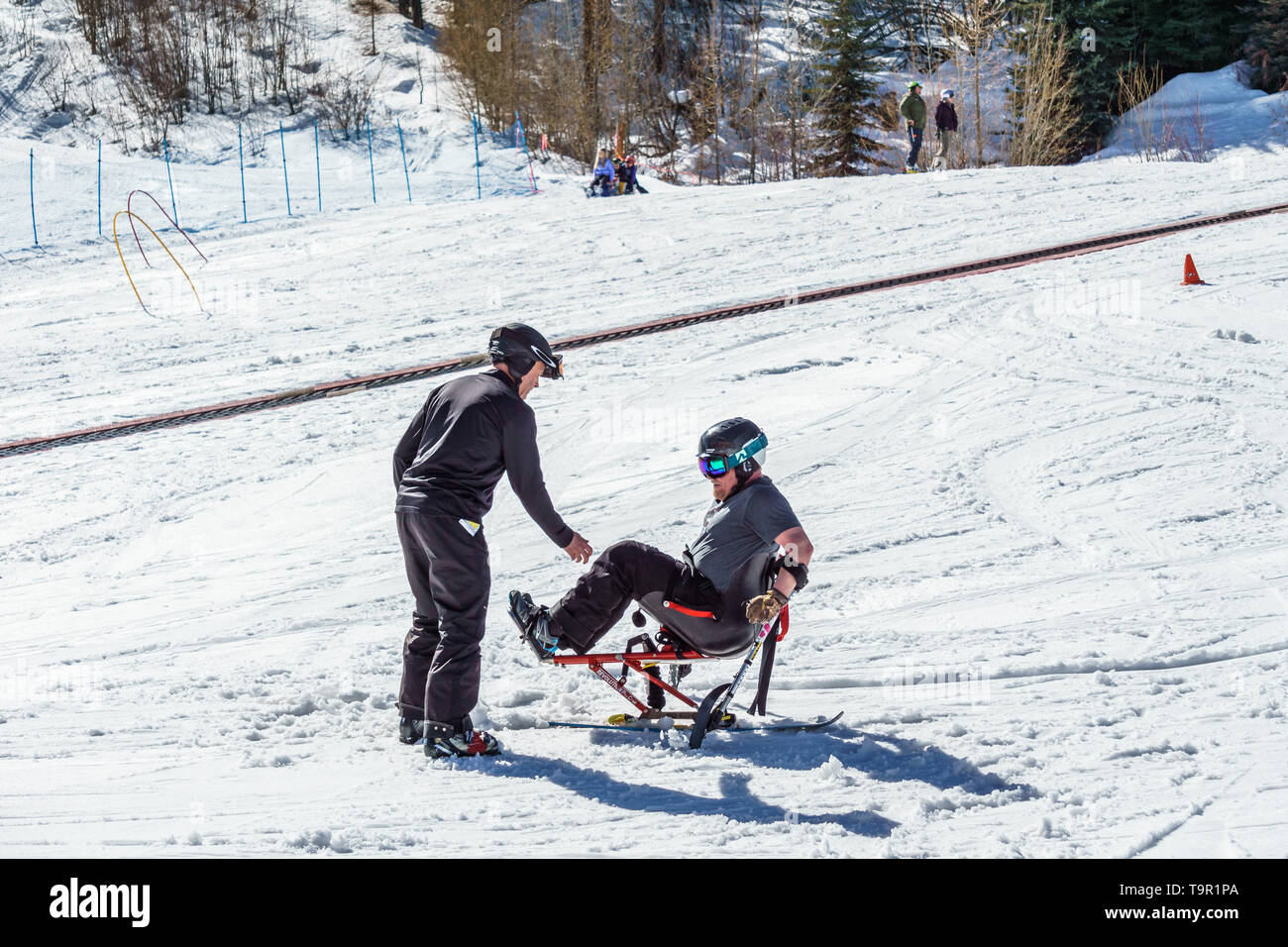KIMBERLEY, CANADA - MARCH 19, 2019: handicapped person riding a mono ski Vancouver Adaptive Snow Sports Stock Photo