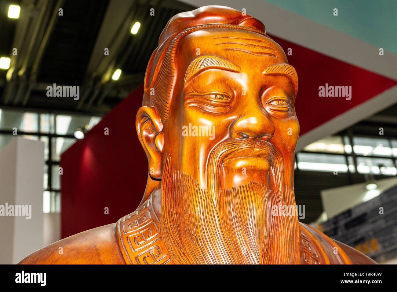 Likeness of Confucius carved in rosewood Stock Photo