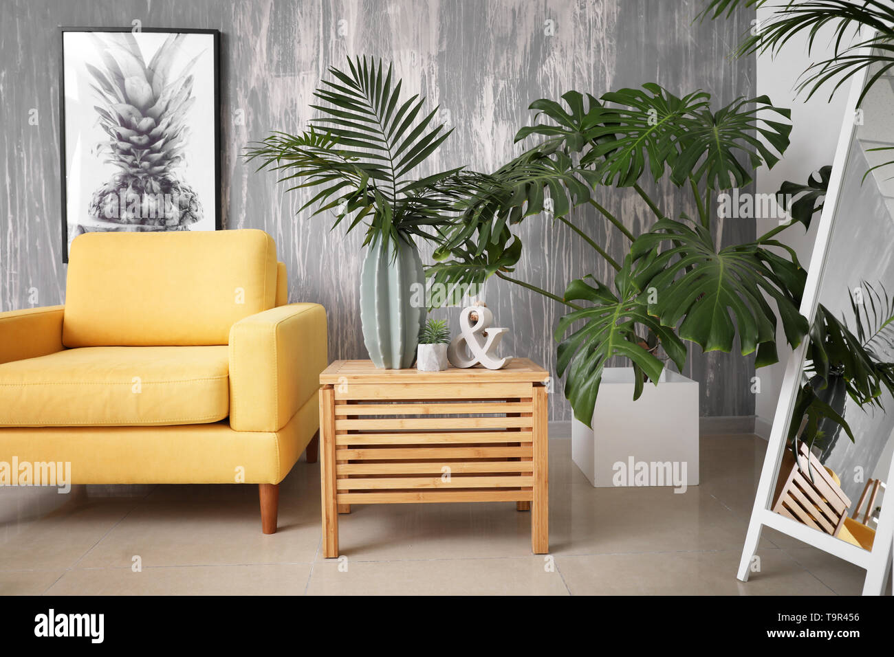 Green Tropical Plants In Interior Of Living Room Stock Photo