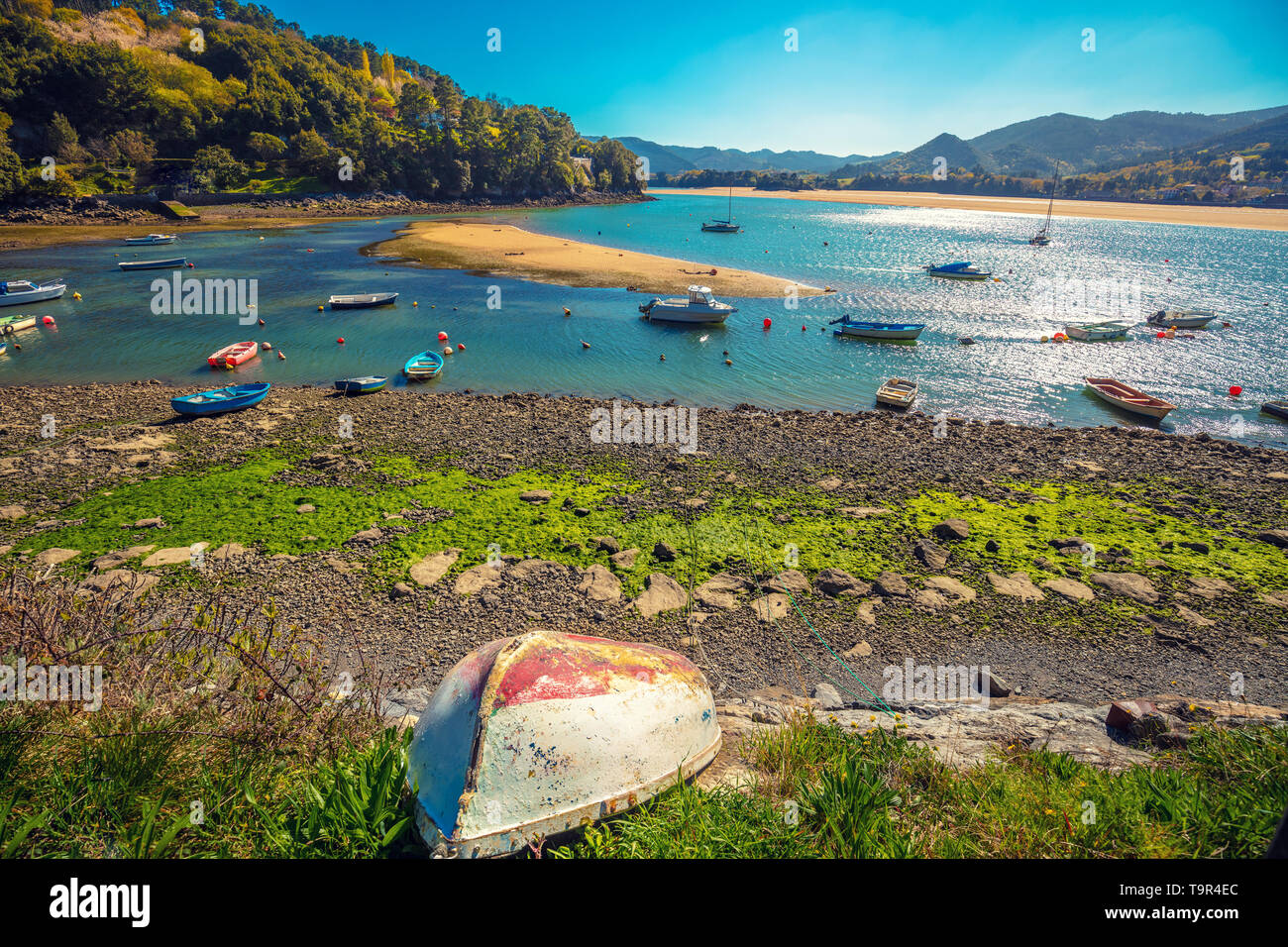 Boats in the bay at low tide. Urdaibai, Biscay, Spain Stock Photo