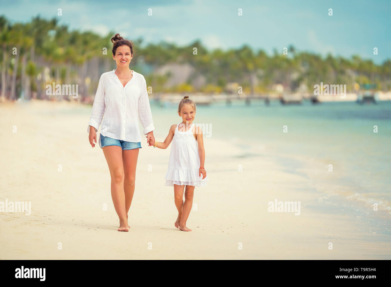 Young mother and little daughter enjoying the beach in Dominican Republic Stock Photo