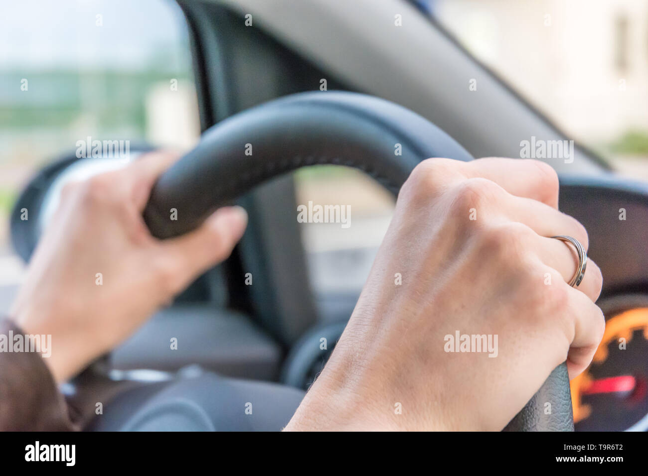 Woman holds the steering wheel tight while driving Stock Photo Alamy