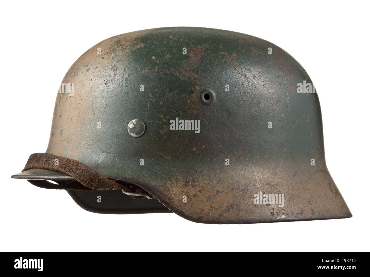 A steel helmet M 40 for army personnel in Normandy camouflage Steel skull with contemporary green- and earth-brown camouflage, the interior with maker stamps 'NS66' and 'D160', inner liner complete with chinstrap. historic, historical, army, armies, armed forces, military, militaria, object, objects, stills, clipping, clippings, cut out, cut-out, cut-outs, 20th century, Editorial-Use-Only Stock Photo