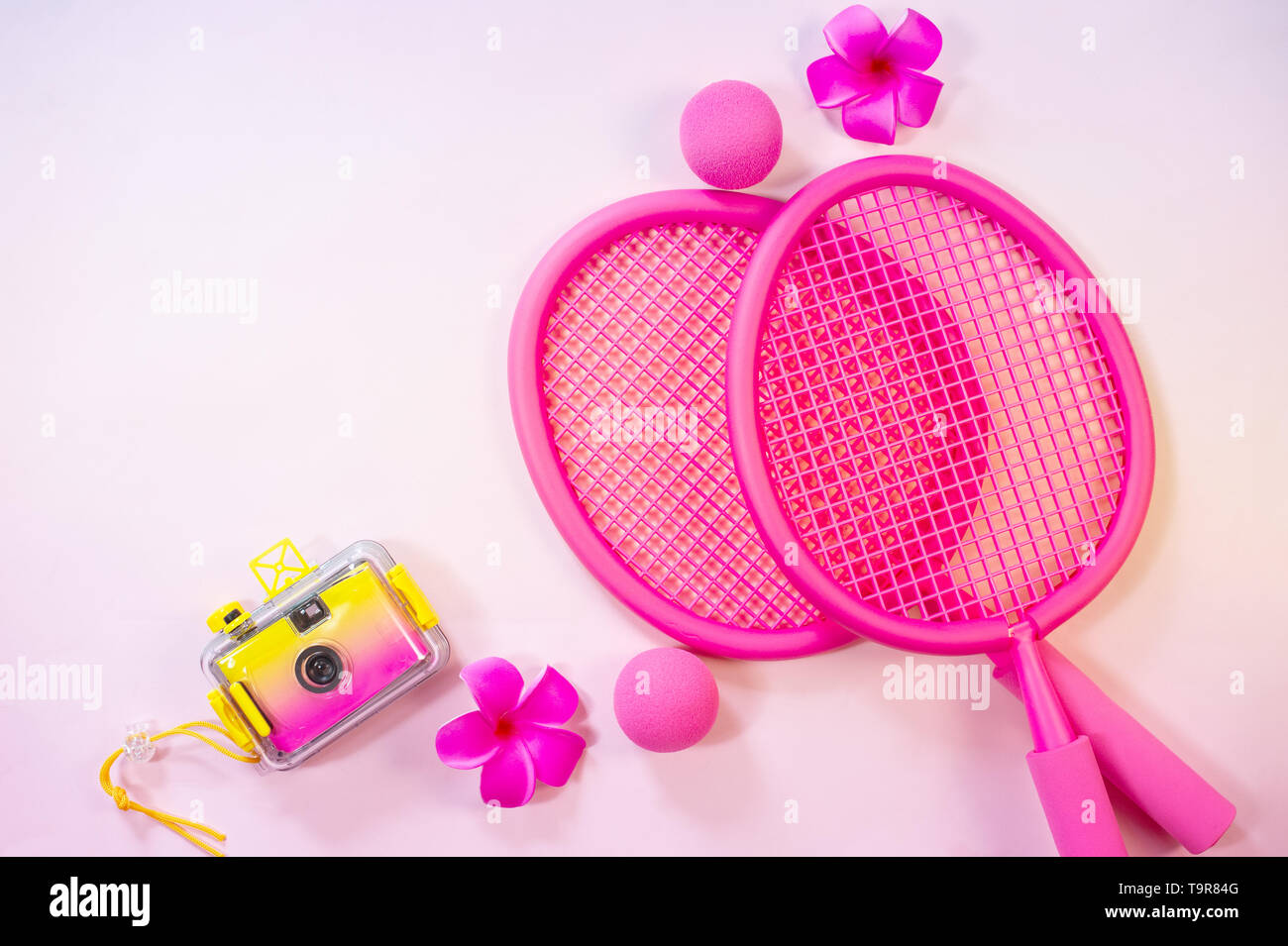 Beach tennis rackets with photo camera travel vacation concept Stock