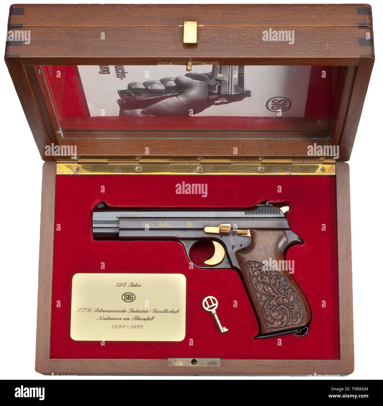 A SIG JP 210 commemorative pistol '125 Jahre SIG', in its casket Cal. 9 mm Parabellum, no. JP 364 (of 500 weapons). Matching numbers. Bright bore. Proof-marked 1978. On planished surface gold-inlaid commemorative inscription '125 Jahre - SIG - 1853-1978'. Gilded operational parts. No swivel rings. Walnut grip panels with acanthus pattern. Magazine. In walnut casket with additional glass panel. Dimensions 30 x 20 x 10 cm, lined with bordeaux-red silk velour and commemorative badge. Key. Brand new collector's item. Erwerbsscheinpflichtig. historic,, Additional-Rights-Clearance-Info-Not-Available Stock Photo