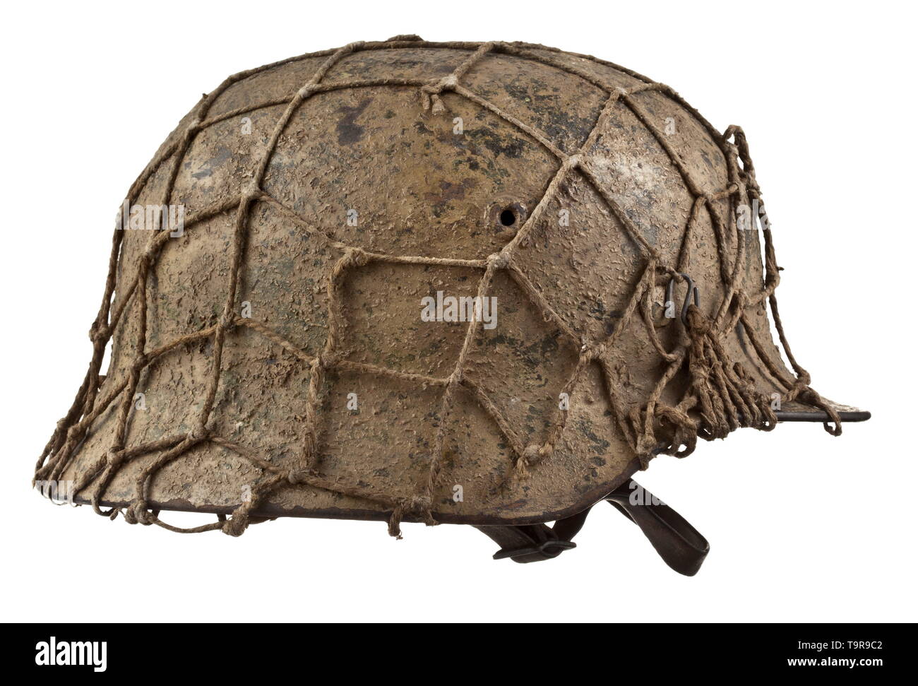 A steel helmet M 40 in Normandy camouflage with camo net Maker Quist, Esslingen Steel skull with preserved ochre, green and earth-brown rough camouflage paint, on which is a net for affixing additional camouflage material, the interior with maker stamps 'Q64' and 'T730'. Complete inner liner with chinstrap, obvious signs of usage. historic, historical, army, armies, armed forces, military, militaria, object, objects, stills, clipping, clippings, cut out, cut-out, cut-outs, 20th century, Editorial-Use-Only Stock Photo