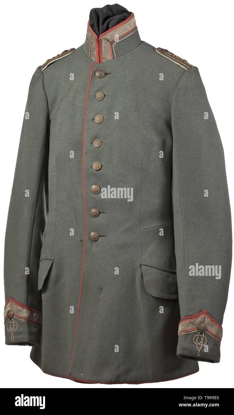 A tunic M 1908/15 of a Provincial Landwehr cavalry officer in the rank of 1st Lieutenant in the 9th Army Corps Field-grey tunic made of cotton cloth in officer quality, ponceau red piping, stand-up collar and Polish cuffs. The collar and cuffs set with patterned braid with red edges, additional gold cord with loops and knots for the provincial cavalry. Sewn-on shoulder boards for 1st lieutenant, applied gilt number "9" for the army corps, black interweaves, white underlay. Grey-brown lining with deleted theatre stamps, size indication "58" and fu, Additional-Rights-Clearance-Info-Not-Available Stock Photo