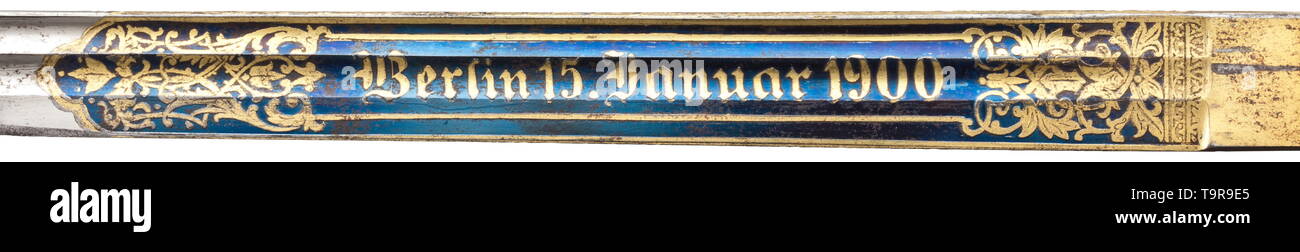 A presentation sword M 1889 for officers of the infantry, dated 1900 Nickel-plated, single-edged blade with double fullers on both sides, with elaborate, beautifully preserved gilt etching against a blued background, the obverse with dedication 'Otto Salchow s/l. Ernst Buhtz' between tendrils and the reverse with date 'Berlin 15. Januar 1900' in the same style. The back with etched and gilt laurel leaves. Knuckle-bow hilt made of gilt non-ferrous metal (rubbed) lavishly decorated in relief, with folding guard plate (sovereign's cypher 'WR II'), t, Additional-Rights-Clearance-Info-Not-Available Stock Photo