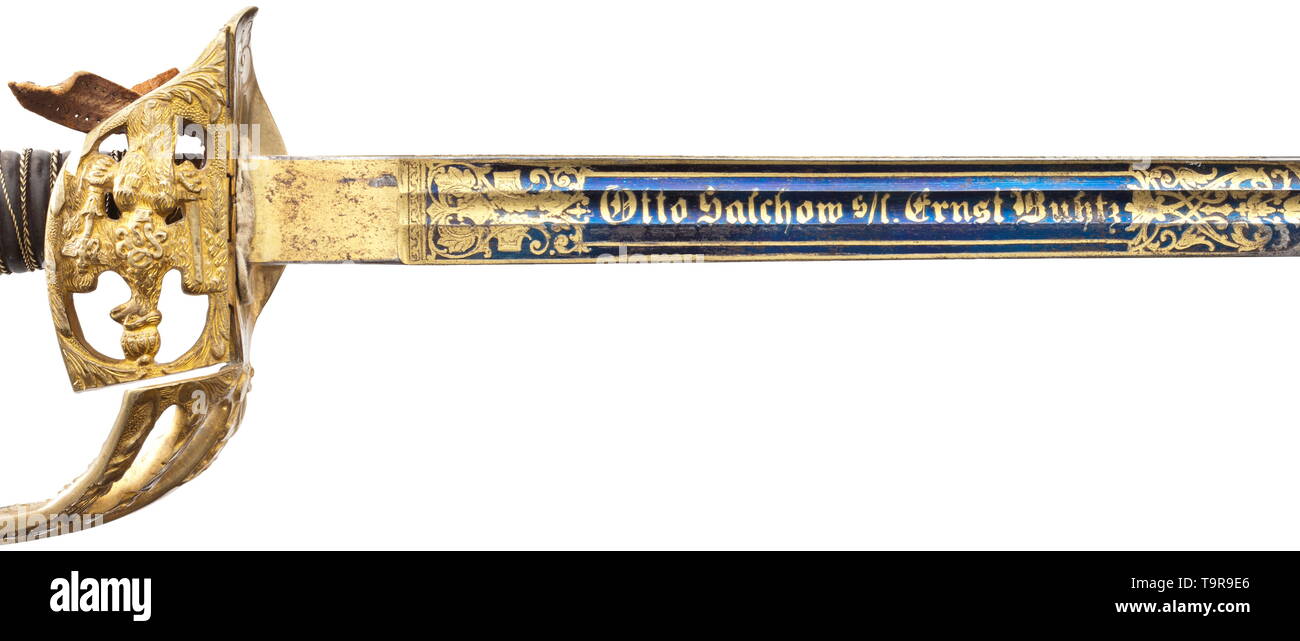 A presentation sword M 1889 for officers of the infantry, dated 1900 Nickel-plated, single-edged blade with double fullers on both sides, with elaborate, beautifully preserved gilt etching against a blued background, the obverse with dedication 'Otto Salchow s/l. Ernst Buhtz' between tendrils and the reverse with date 'Berlin 15. Januar 1900' in the same style. The back with etched and gilt laurel leaves. Knuckle-bow hilt made of gilt non-ferrous metal (rubbed) lavishly decorated in relief, with folding guard plate (sovereign's cypher 'WR II'), t, Additional-Rights-Clearance-Info-Not-Available Stock Photo