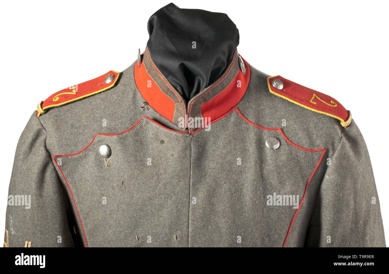 A ulanka M 1908/15 of a sergeant of the Uhlan Regiment No. 7 Field-grey ulanka made of cotton cloth in good quality (depot piece), ponceau red piping, stand-up collar and Polish cuffs. Both the rank distinction buttons on the collar and the remaining white buttons made of nickel. Sewn-on shoulder boards, number '7' in crank embroidery, lemon-yellow piping and additional cord for an equestrian class. The right sleeve with three fencing badges, the cuff with loops for an orders clasp. Grey lining with depot stamps and regimental number 'UR 7'. Tuni, Additional-Rights-Clearance-Info-Not-Available Stock Photo