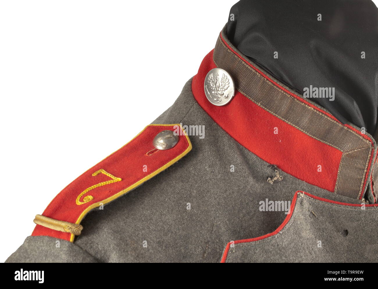 A ulanka M 1908/15 of a sergeant of the Uhlan Regiment No. 7 Field-grey ulanka made of cotton cloth in good quality (depot piece), ponceau red piping, stand-up collar and Polish cuffs. Both the rank distinction buttons on the collar and the remaining white buttons made of nickel. Sewn-on shoulder boards, number '7' in crank embroidery, lemon-yellow piping and additional cord for an equestrian class. The right sleeve with three fencing badges, the cuff with loops for an orders clasp. Grey lining with depot stamps and regimental number 'UR 7'. Tuni, Additional-Rights-Clearance-Info-Not-Available Stock Photo