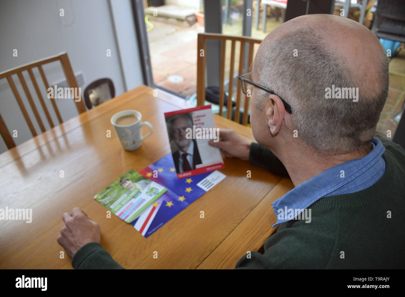 European Parliament Elections May 2019 - man reading various Labour Party political party leaflet. UK May 2019 Stock Photo