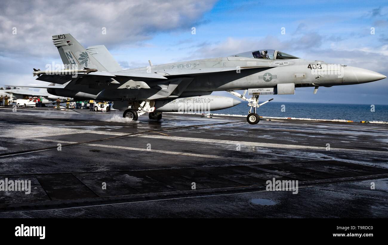 190516-N-ZM949-2121 GULF OF ALASKA (May 16, 2019) An F/A-18E Super Hornet assigned to the “Golden Warriors” of Strike Fighter Squadron (VFA) 87 makes an arrested landing on the flight deck of the aircraft carrier USS Theodore Roosevelt (CVN 71) while participating in Exercise Northern Edge 2019. Northern Edge is one in a series of U.S. Indo-Pacific Command exercises in 2019 that prepares joint forces to respond to crisis in the Indo-Pacific region. (U.S. Navy photo by Mass Communication Specialist 3rd Class Erick A. Parsons/Released) Stock Photo