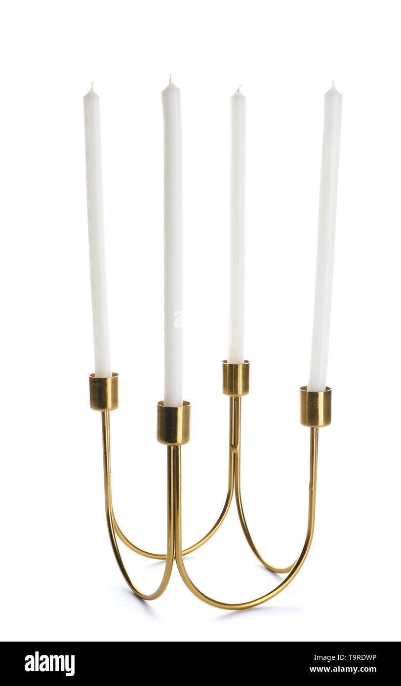 Golden holder with candles on white background Stock Photo - Alamy