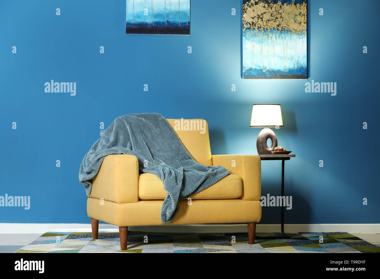 Modern interior of room with stylish armchair Stock Photo - Alamy