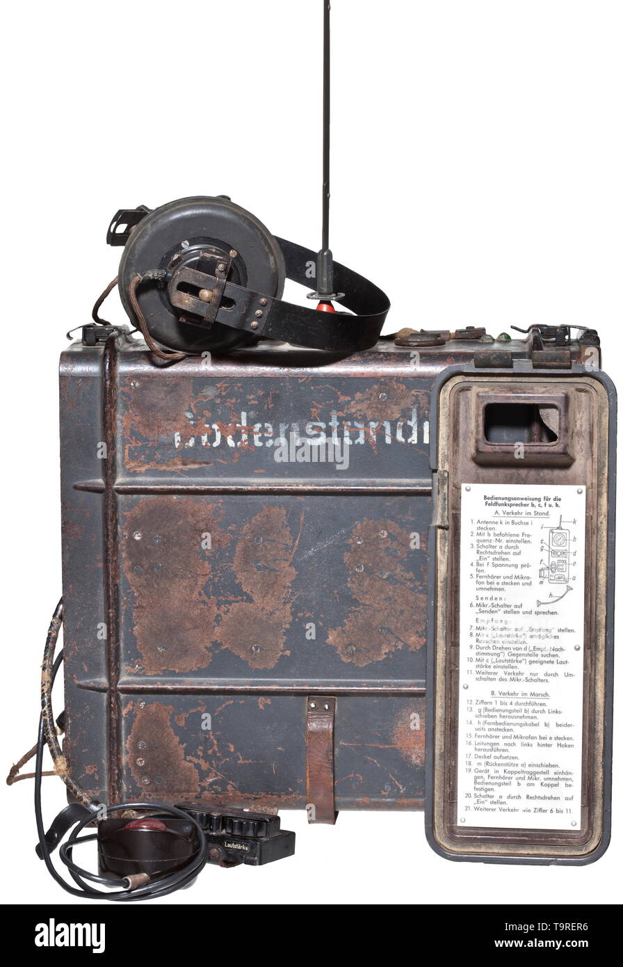 A field radio set "Feldfu.b2" Dark-grey painted Bakelite housing, lateral  imprint "Bodenständig". Removable apparatus lid, the outside with phonetic  spelling chart, the inside with rivet affixed operating instructions.  Hinged cover for technical