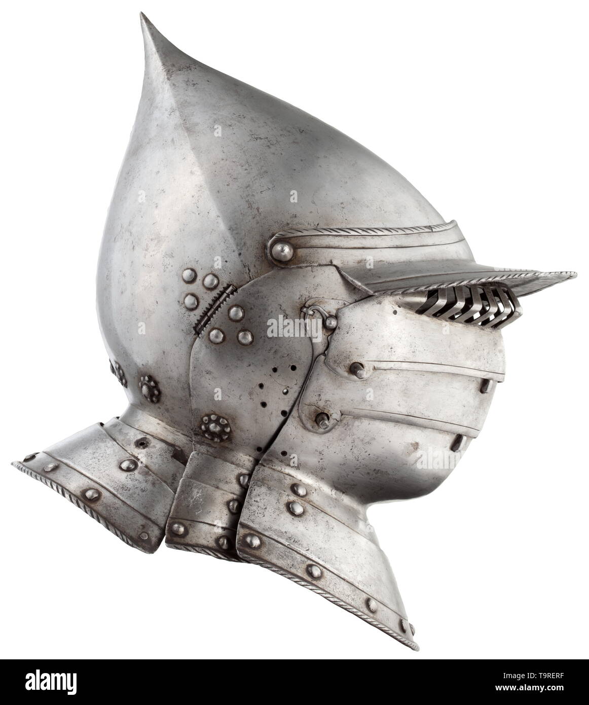 A South German burgonet with pivoted bevor, probably from Augsburg, circa 1550/60 The skull of the Hungarian type forged in one piece, the four ridges terminating in one narrow point. Movable peak with a turned and roped edge, the plume socket mounted on the left. Hinged cheek pieces with eight pierced openings for hearing. The neck guard sliding on two lames, also with a turned and roped edge. One rivet is missing. Corresponding bevor, fastened with two lateral hook-and-eye closures. Pivoted chin guard sliding on two lames, with spring-loaded ca, Additional-Rights-Clearance-Info-Not-Available Stock Photo