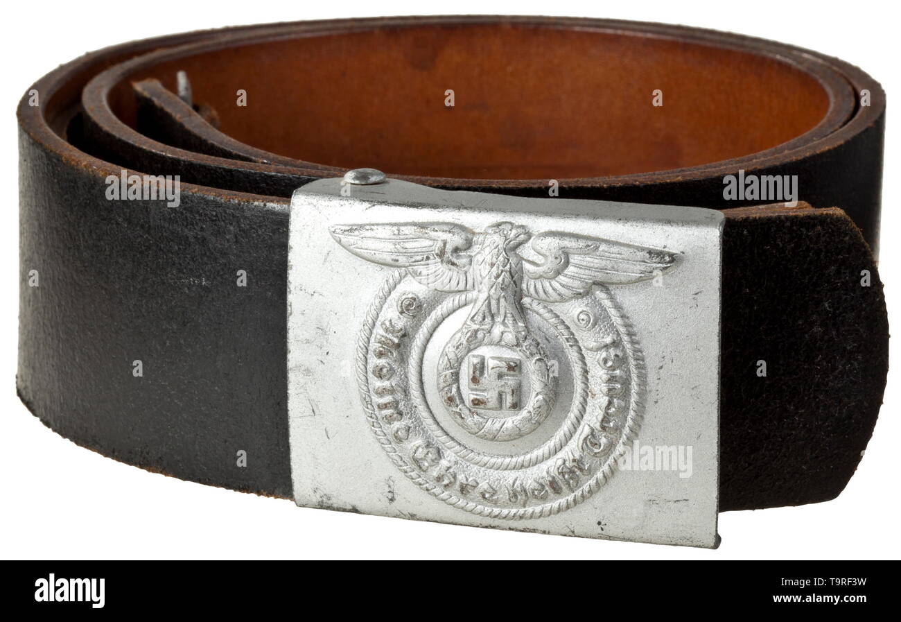 A belt buckle for enlisted men/NCOs Silberfarben lackierte, einteilig geprägte Eisenausführung. Schwarzer Lederriemen mit Stempelung 'Jnb 1942'. historic, historical, 20th century, 1930s, 1940s, Waffen-SS, armed division of the SS, armed service, armed services, NS, National Socialism, Nazism, Third Reich, German Reich, Germany, military, militaria, utensil, piece of equipment, utensils, object, objects, stills, clipping, clippings, cut out, cut-out, cut-outs, fascism, fascistic, National Socialist, Nazi, Nazi period, Editorial-Use-Only Stock Photo