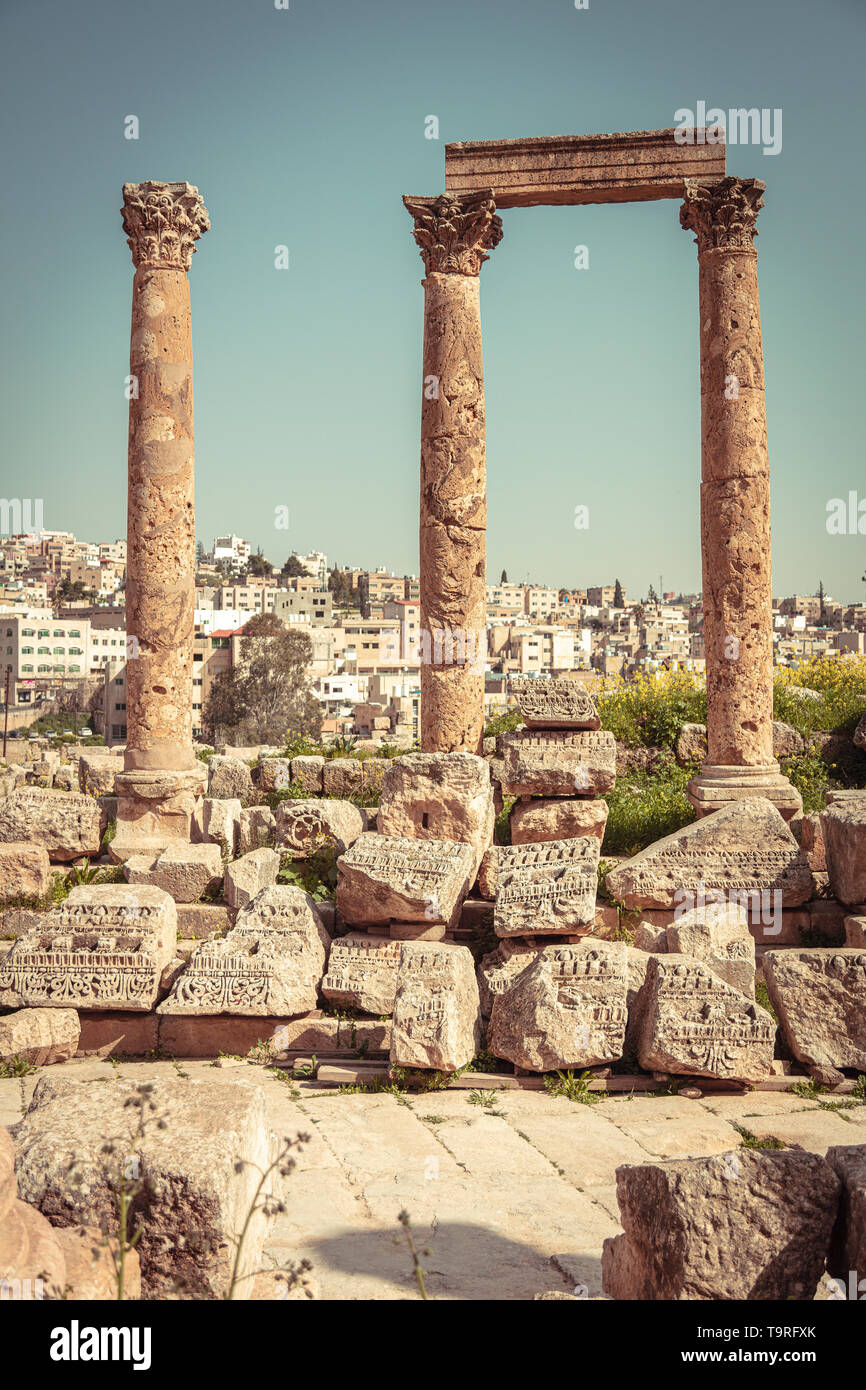ancient columns in the citadel of Amman, old city in the background. Jordan. Stock Photo