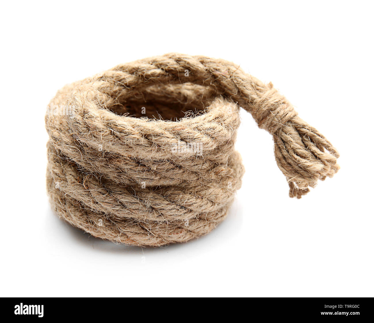 Rolled rope on white background Stock Photo - Alamy